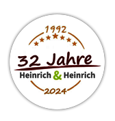 32 Jahre Heinrich & Heinrich Logo