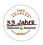 32 Jahre Heinrich & Heinrich Logo